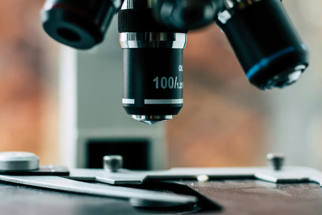 Close up of a microscope on a laboratory bench