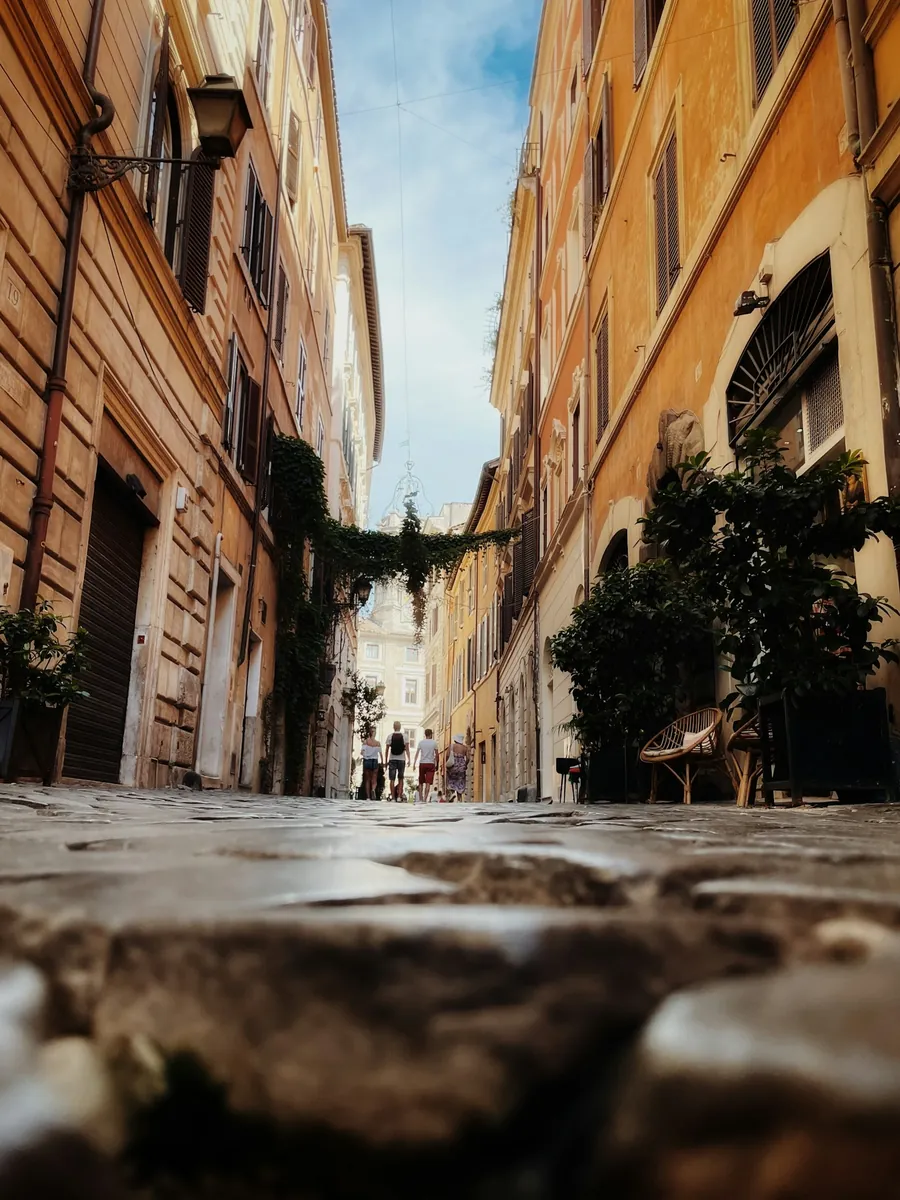 A sunny, narrow cobbled lane in the old centre of Rome