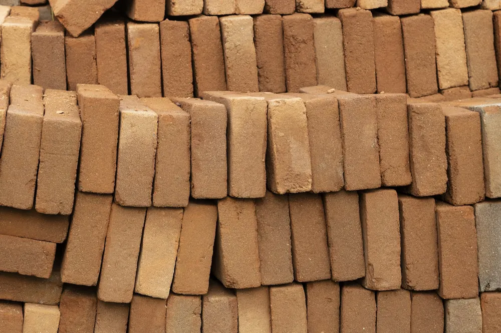 Fired clay bricks stacked side by side
